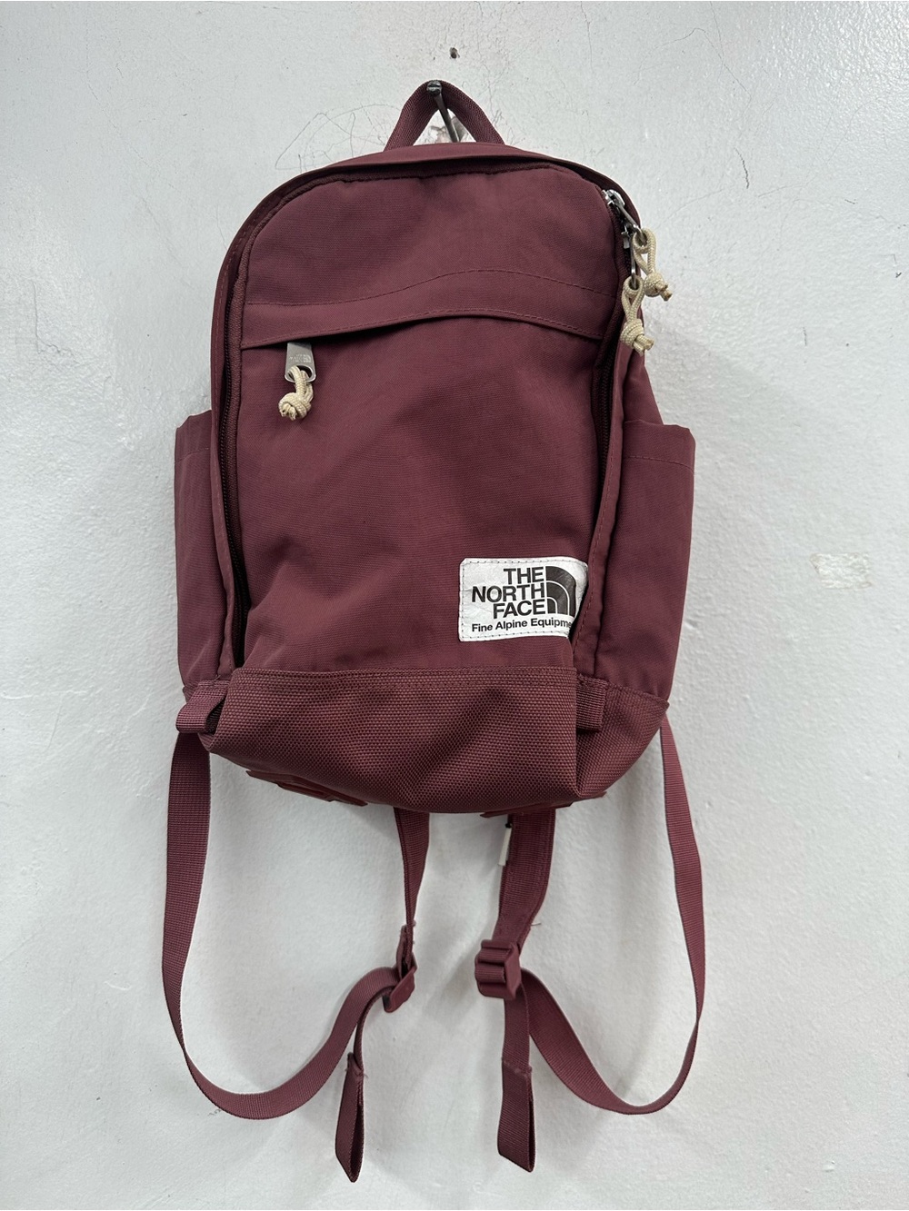 The North Face Mini Backpack in Burgundy